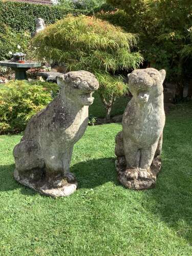 Superb pair of weathered reconstituted sitting Jaguars on bases
