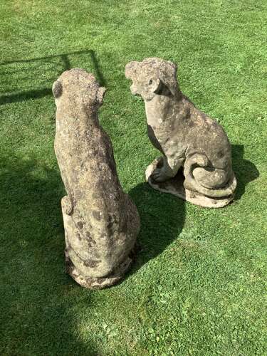 Superb pair of weathered reconstituted sitting Jaguars on bases