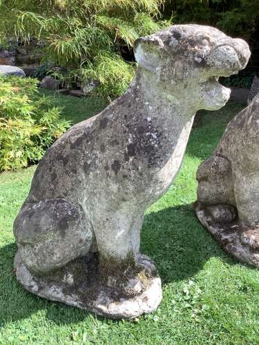 Superb pair of weathered reconstituted sitting Jaguars on bases
