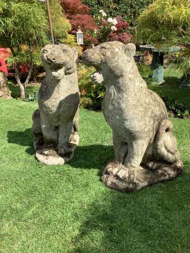 Superb pair of weathered reconstituted sitting Jaguars on bases